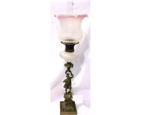 Late 19th century figural brass oil lamp with frosted glass reservoir and glass chimney, overall H: 79 cm. Not available for 