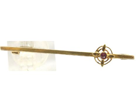 Boxed 9ct yellow gold bar brooch set with a small ruby, L: 51 mm, 2.6g. P&amp;P Group 1 (£14+VAT for the first lot and £1+VAT