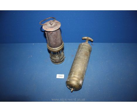 A Brass miner's Lamp numbered 624 and a brass 'Quelfyre' fire extinguisher.