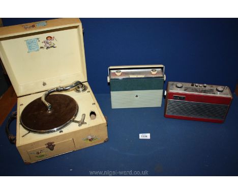 A small Bush radio together with a small Roberts radio RT22 and a child's record player decorated with nursery rhymes, a/f.