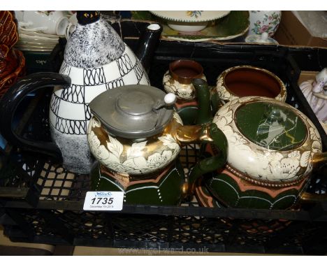 A five piece green and gold Teaset and a Nina Lyman teapot.