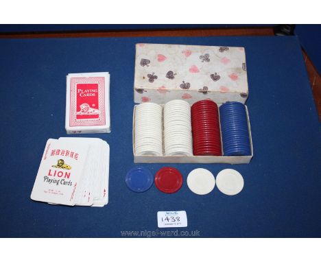 A box of 100 circular Gambling Chips in cream, crimson and blue and a quantity of playing cards.