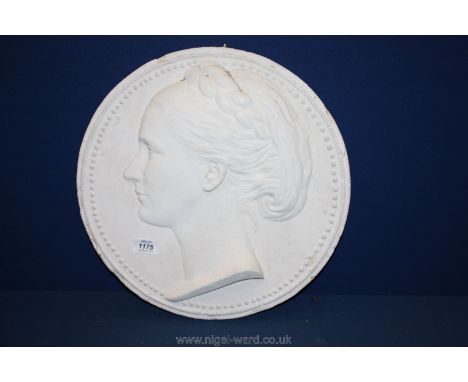 A large plaster relief Portrait of a woman.