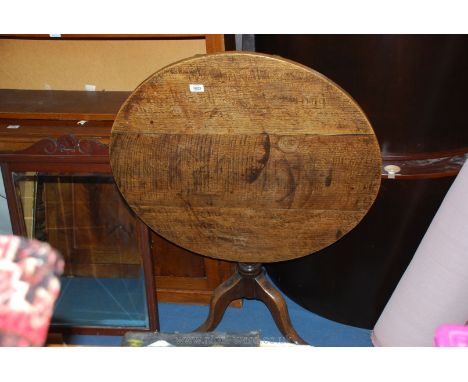 A good Oak three plank top circular occasional Table having a baluster turned pillar and three elegant splay feet, 33'' diame
