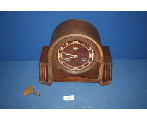 A Bentima mantle clock and key.