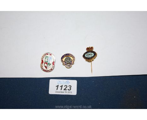 Three enamel badges: red and silver Investiture, Order of Buffalo and British Legion.