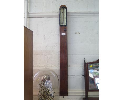 A late Victorian oak framed stick barometer, with thermometer, the ivory dial inscribed John Davis &amp; Son (Derby), 94 cm l