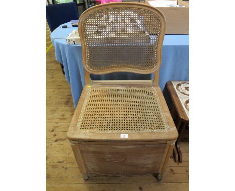 A French pine canework commode chair