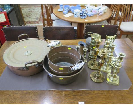 A copper jam pan, 43cm diameter, other copper pans, brass candlesticks, brass Cambrian miner's lamp, and other brass and copp