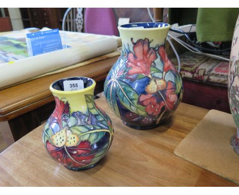 A large Moorcroft vase, in blue and yellow with floral design, dated 1999, 23.5 cm high, another vase similar,  16 cm high, a