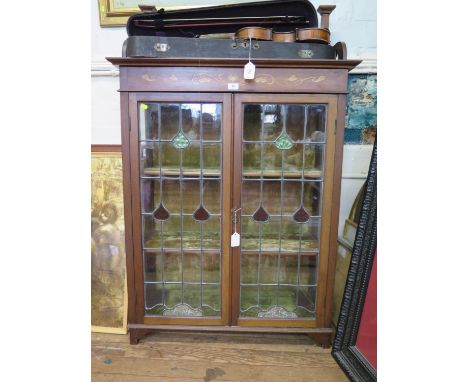 A late Victorian Art Nouveau style inlaid mahogany display cabinet, the raised back over lead glazed doors enclosing a velvet