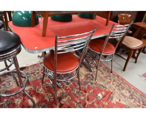A vintage American diner style table and pair of complimentary chairs