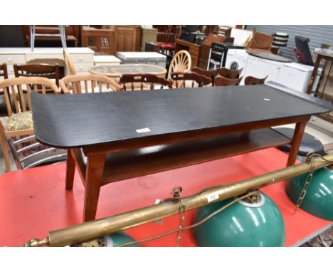 A vintage coffee table having shaped ply top