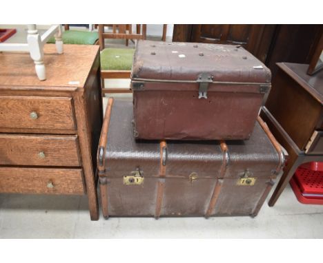 Two vintage travel trunks, including cloth and wood bound and tin bearing shipping labels including Union Castle line
