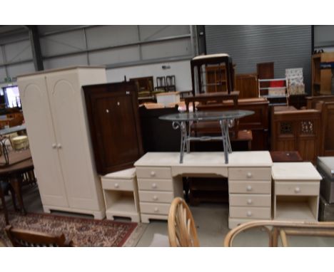 A selection of modern laminated white bed room furniture including bedside cabinets dressing table and wardrobe