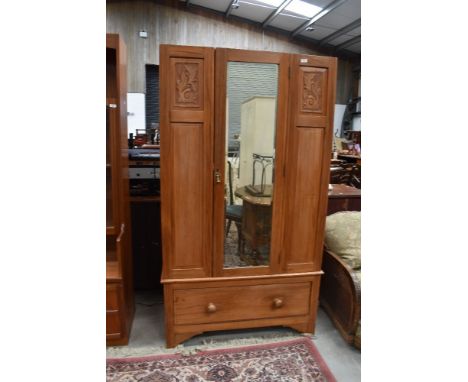 A Victorian stripped mirror door wardrobe (no crown)