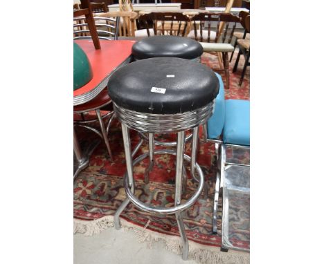 A pair of vintage chrome bar stools