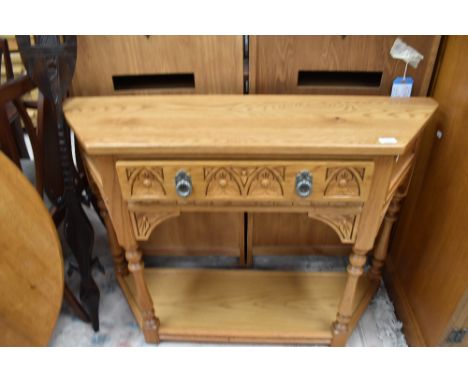An Old Charm hall table in light oak