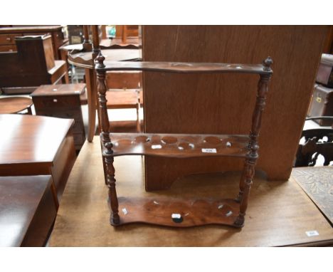 A small Victorian style mahogany waterfall style open wall shelf , width approx. 44cm