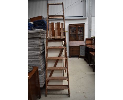 A set of traditional pitch pine step ladders