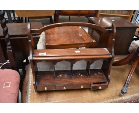 A 19th Century mahogany wall shelf with stationery compartments, width approx. 42cm