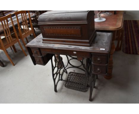 A 19th Century American treadle sewing machine, labelled New Home Sewing Machine Company, Orange Mass, Ruby model