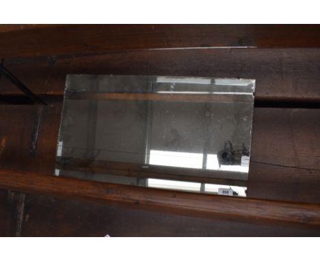 A vintage frameless mirror