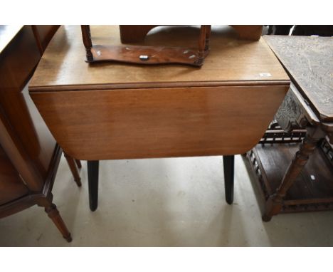 A mid century dop leaf dining table by G Plan Librenza Butterfly design by Brandon Light