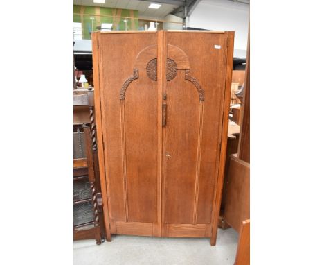 An Edwardian wardrobe with oak carcass and decorative front panel 91cm wide