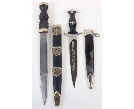 Modern Scottish Pipers Dirk, with carved wooden handle with meal studs. EIIR crown pommel disc. Housed in a leather covered s