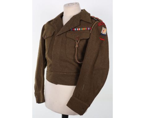 Scarce WW2 Devonshire Regiment Battle Dress Blouse, being a war aid pattern blouse tailored with an open collar. Scarce green