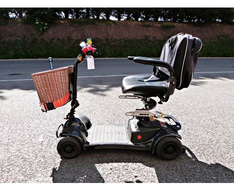 Ableworld motorised battery charged wheelchair with basket and walking stick
