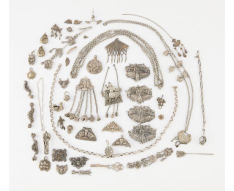 Approximately 51 pieces of Chinese jewelry components and amulets of indeterminant silver content. Marked variously. Includin
