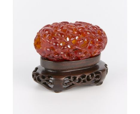 Small Chinese pierced amber pendant or carving. With wooden stand.(Carving, without stand) height: 1 in x width: 1 3/4 in x d