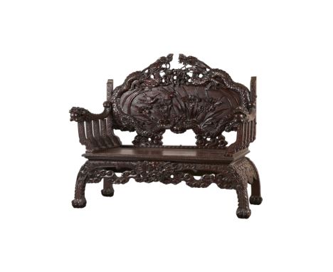 Ornately carved Asian, possibly Japanese export, lacquered hardwood bench or loveseat depicting profuse mythical and geometri