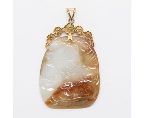 Tricolor carved jade pendant depicting a foo dog playing with a ball of yarn and a bat. Set on a 14k yellow gold decorative b