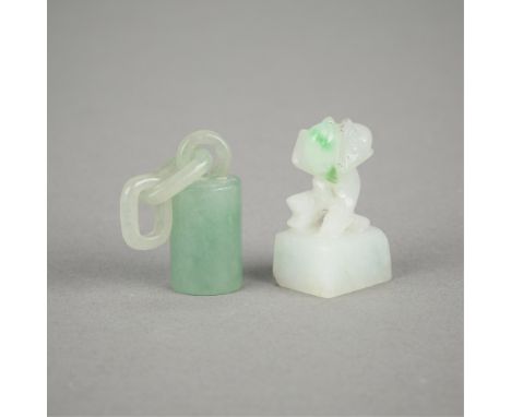 Group of two small Chinese carved jades. One in the form of a monkey and the second in the form of a small cylinder with a sh