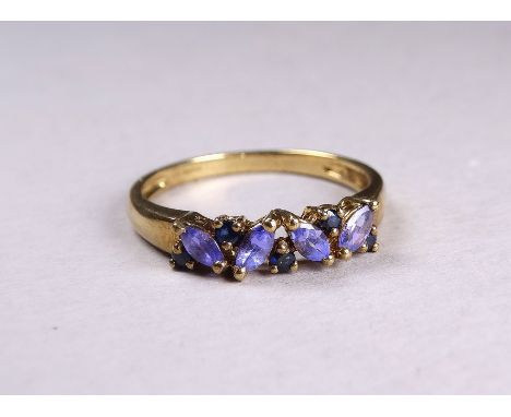 A 9ct yellow gold ring - set with sapphire and tanzanite, size V/W, weight 2.8g. 