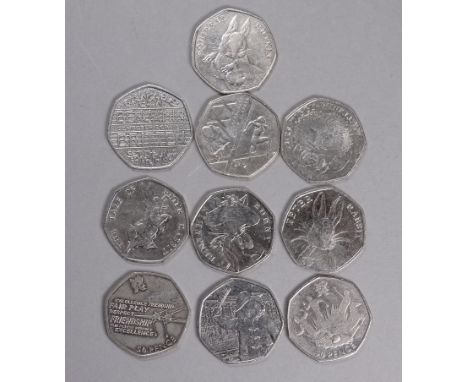 Ten commemorative 50 pence coins - to include Olympics, Paddington Bear, Peter Rabbit etc. 