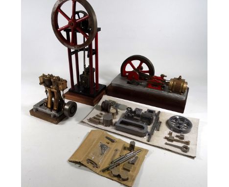A Stuart stationary engine - on a mahogany base, together with three further stationary engines and another. 