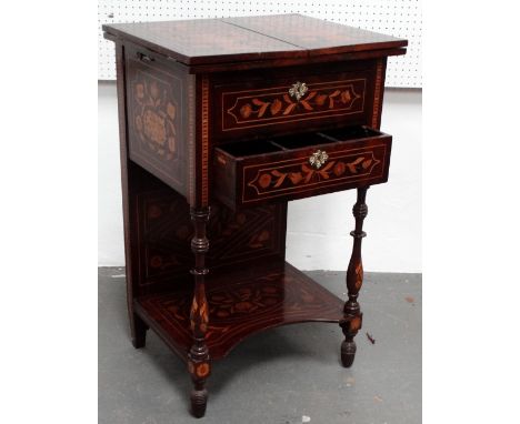 An early 19th century Dutch mahogany and inlaid kettle stand - the rising shelf back above a book folding top inlaid with vas