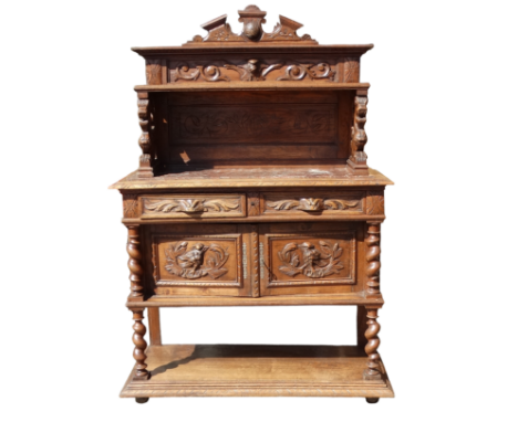 A 17th century style continental carved oak buffet - the raised back with shelf and lion supports above a rouge marble top, t