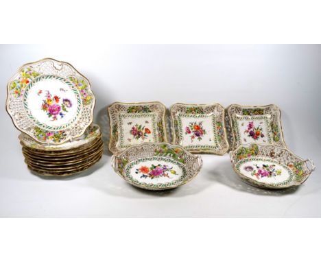 A 19th century continental porcelain fruit service - of reticulated design and finely decorated with flowers and foliage, com
