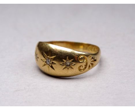 An 18ct yellow gold gypsy set ring - with mine cut diamonds, weight 2.3g.