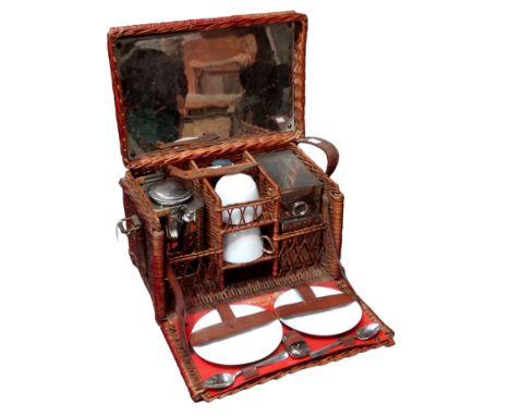 An early 20th century wicker picnic hamper for two - including a spirit kettle, cups, saucers and a sandwich box, width 30cm.