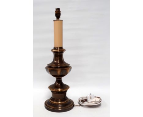 A brass table lamp - of octagonal baluster form, height 70cm.