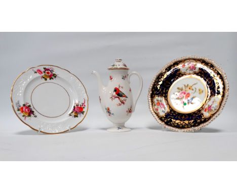 A Royal Crown Derby cabinet plate - decorated with floral vignettes on a dark blue ground with gilt foliage between, diameter