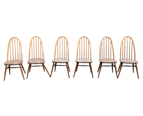 A set of six Ercol dining chairs - with stick backs and solid contoured seats on turned legs joined by an H-shaped stretcher 