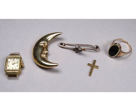 A 9ct yellow gold brooch - modelled in the form of a moon, together with a cross, a yellow metal bar brooch, a yellow metal w