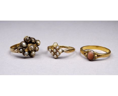 An 18ct yellow gold seed pearl and ruby set ring - size N, together with two further gem set rings, overall weight 8.7g. 